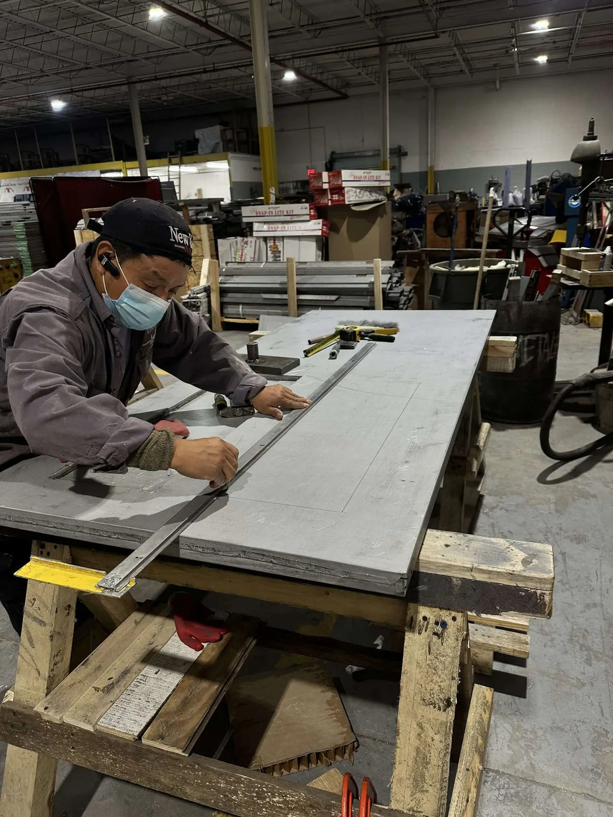 UFD craftsman fabricating a hollow metal door in our New York factory