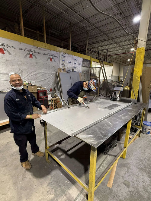 UFD team welding a steel door in the factory